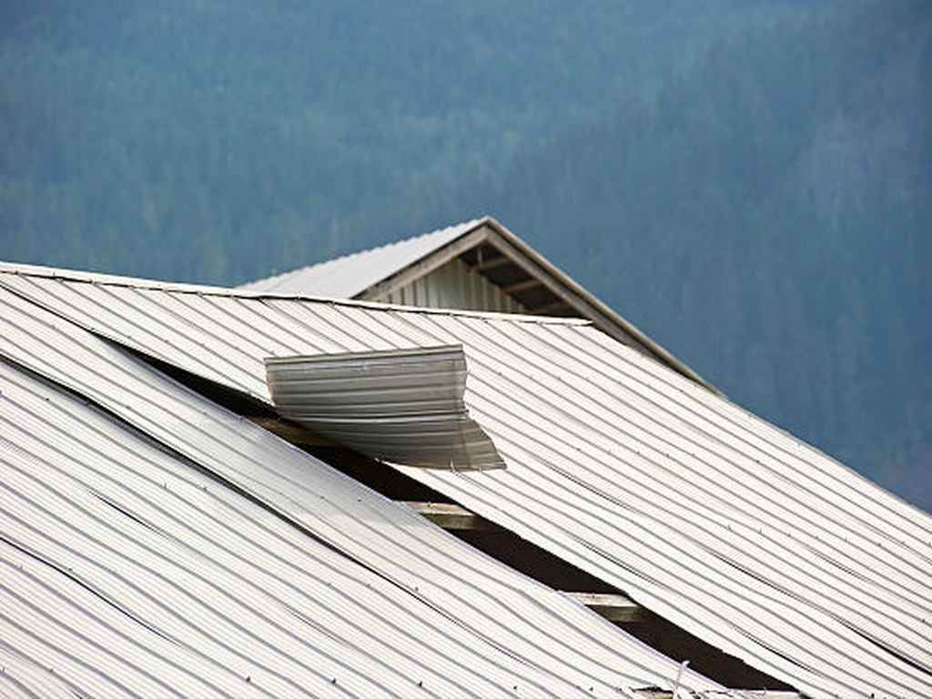 blowing metal roof in Franklin caused by wind